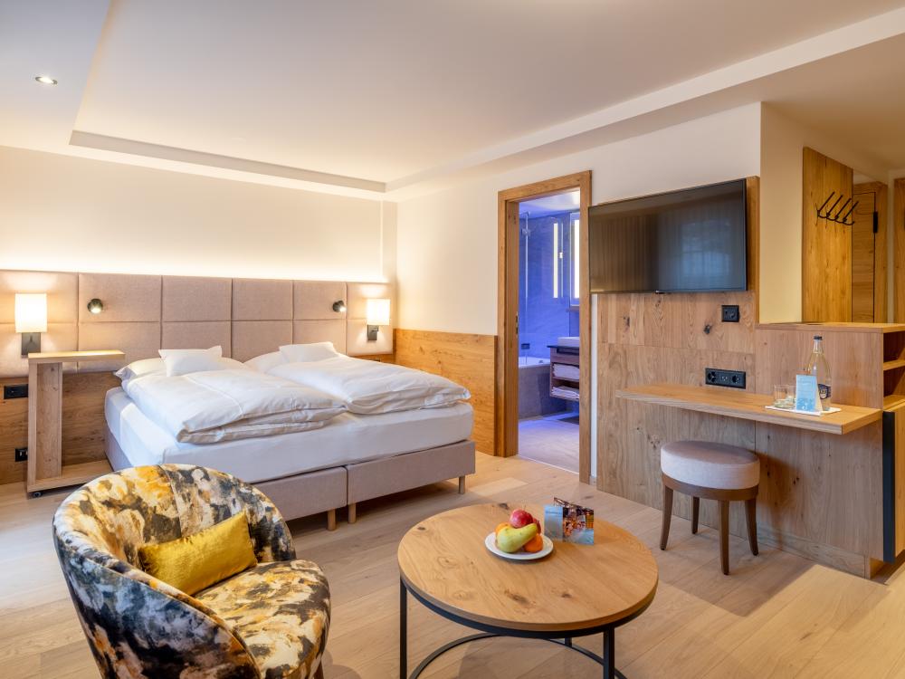 Modern room at Resort La Ginabelle Zermatt with wooden accents and cozy atmosphere