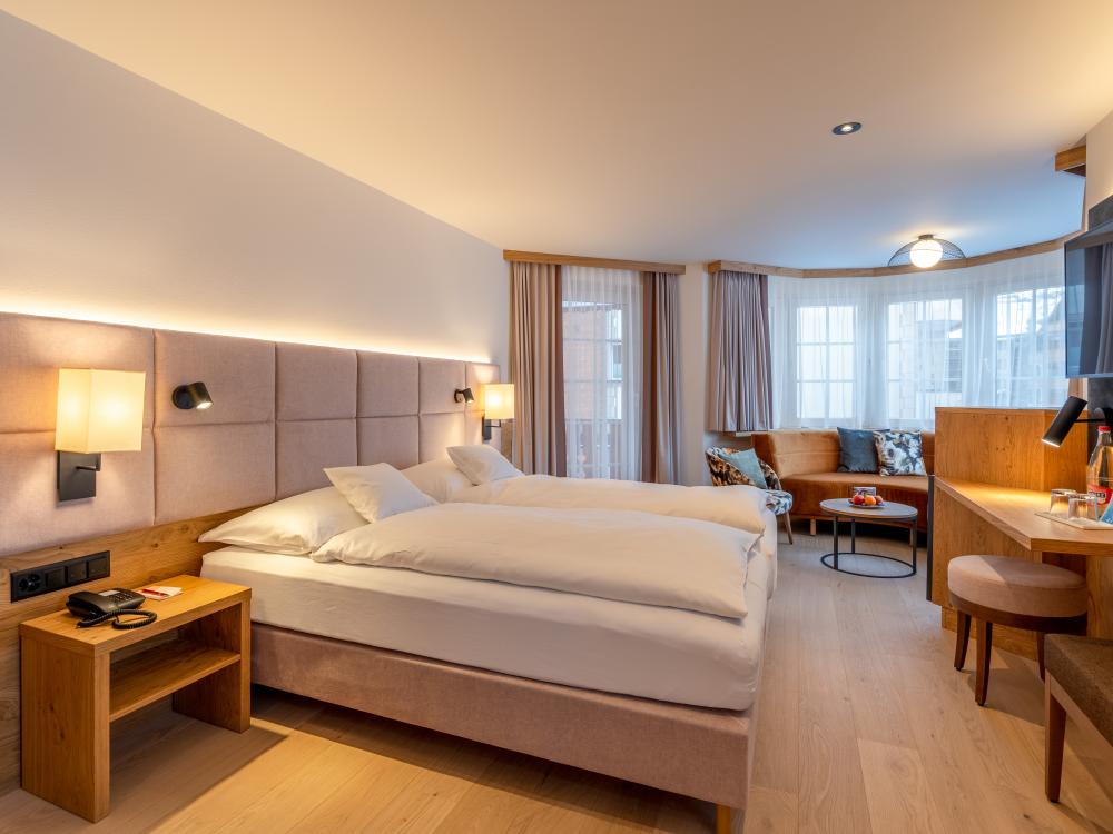Modern double room at Resort La Ginabelle Zermatt with wooden accents