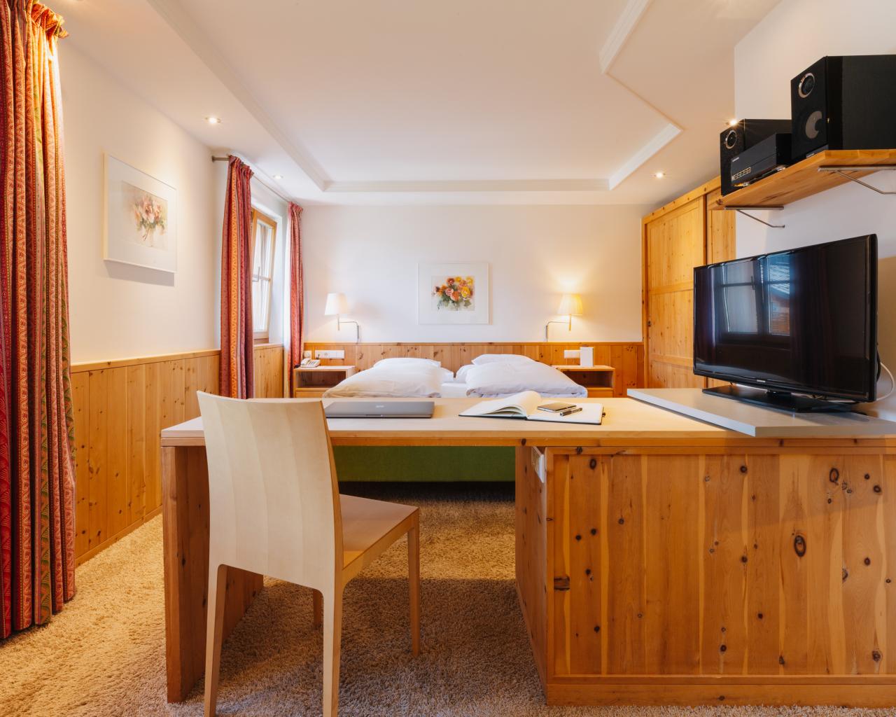 Hotel Aurora room with two single beds and wooden paneling