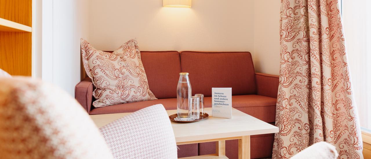 Hotel Aurora lounge seating with sofa, armchairs and coffee table