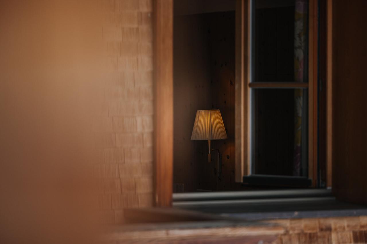 Soft glowing lamp in window at Hotel Aurora