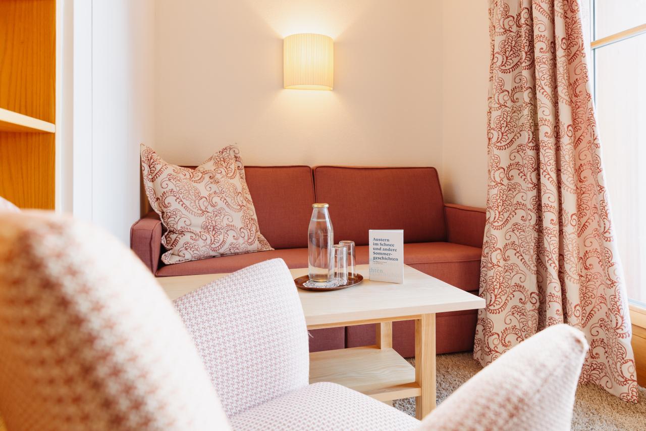 Hotel Aurora lounge seating with sofa, armchairs and coffee table