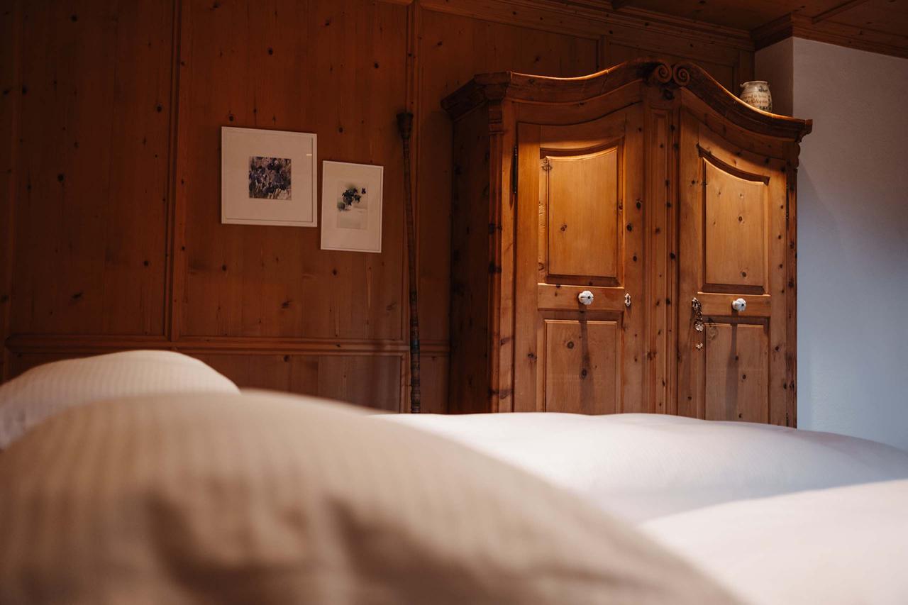 Cozy room at Hotel Aurora with wooden furniture and soft pillows