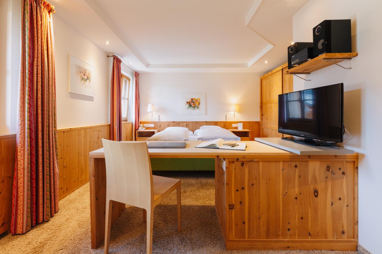 Hotel Aurora room with two single beds and wooden paneling