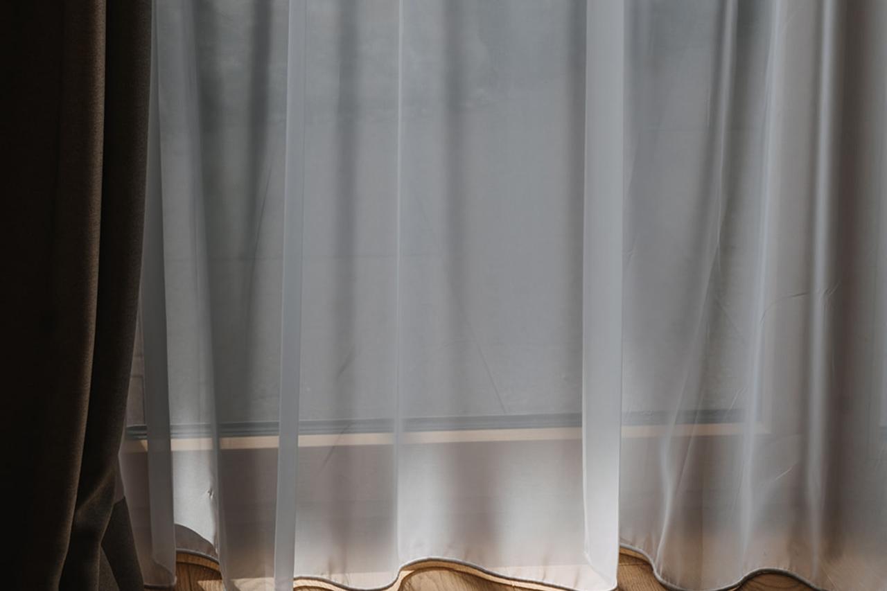 Hotel Aurora curtain with soft light on wooden floor