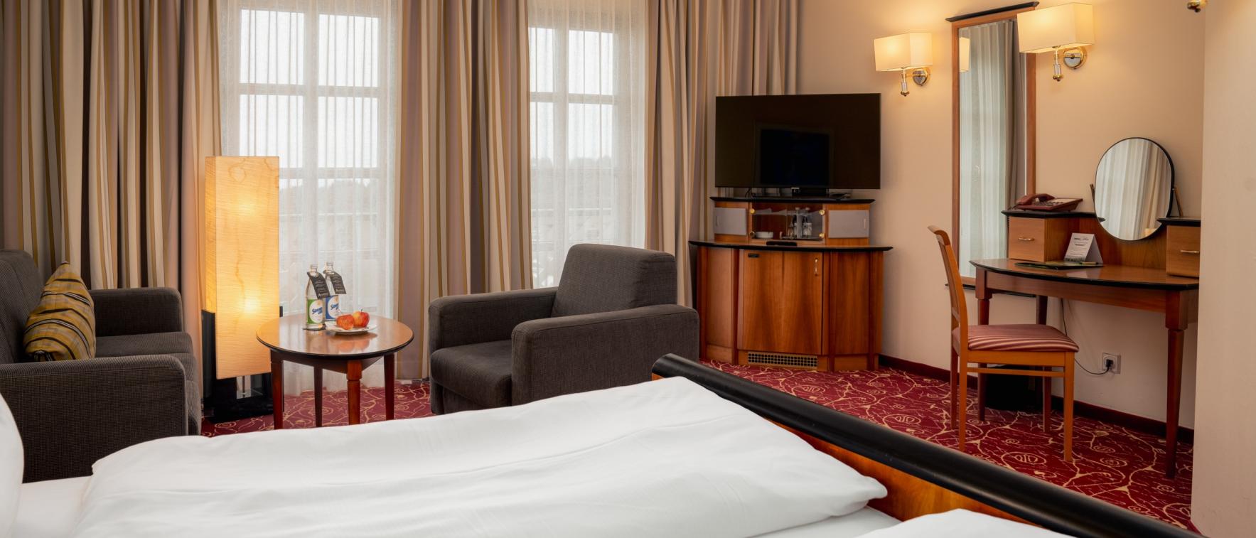 Gemütliches Zimmer im Sport- und Wellnesshotel Angerhof ****S mit Sitzbereich