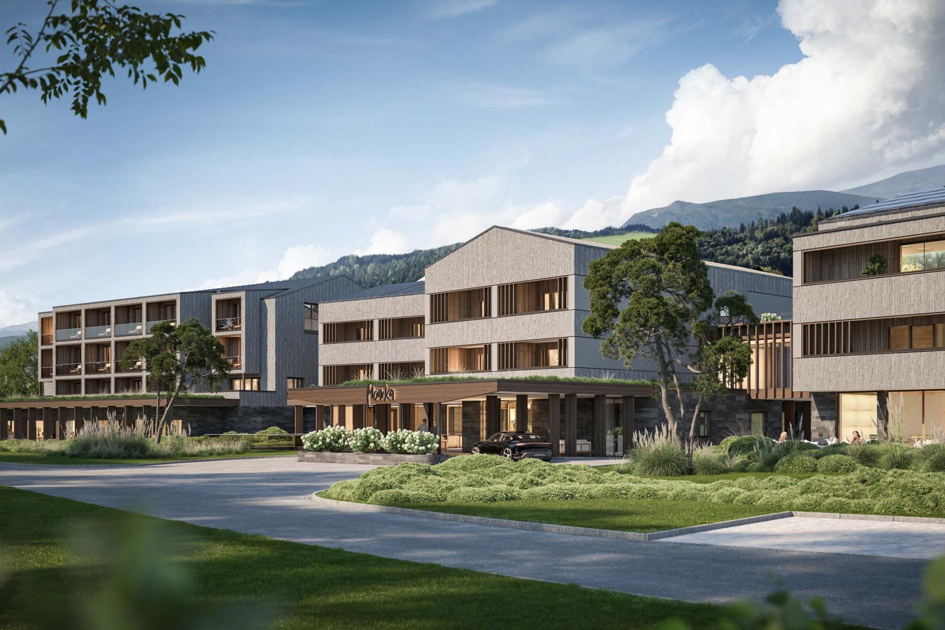 Hotel Monika in natürlicher Umgebung mit Bergen im Hintergrund