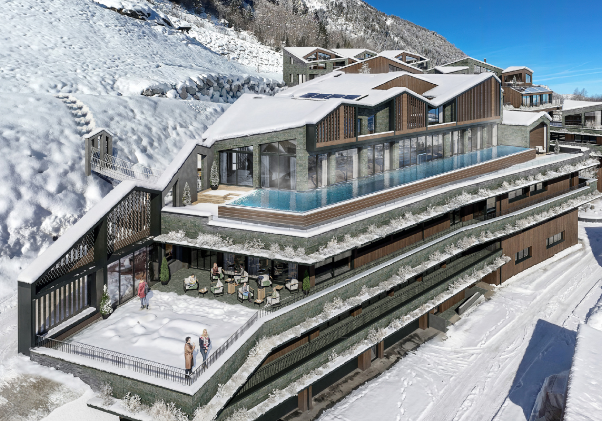 The modern architecture of the Designer Motel Glockna in Fusch am Großglockner, featuring an infinity pool on the roof terrace and the snow-capped Alps in the background.