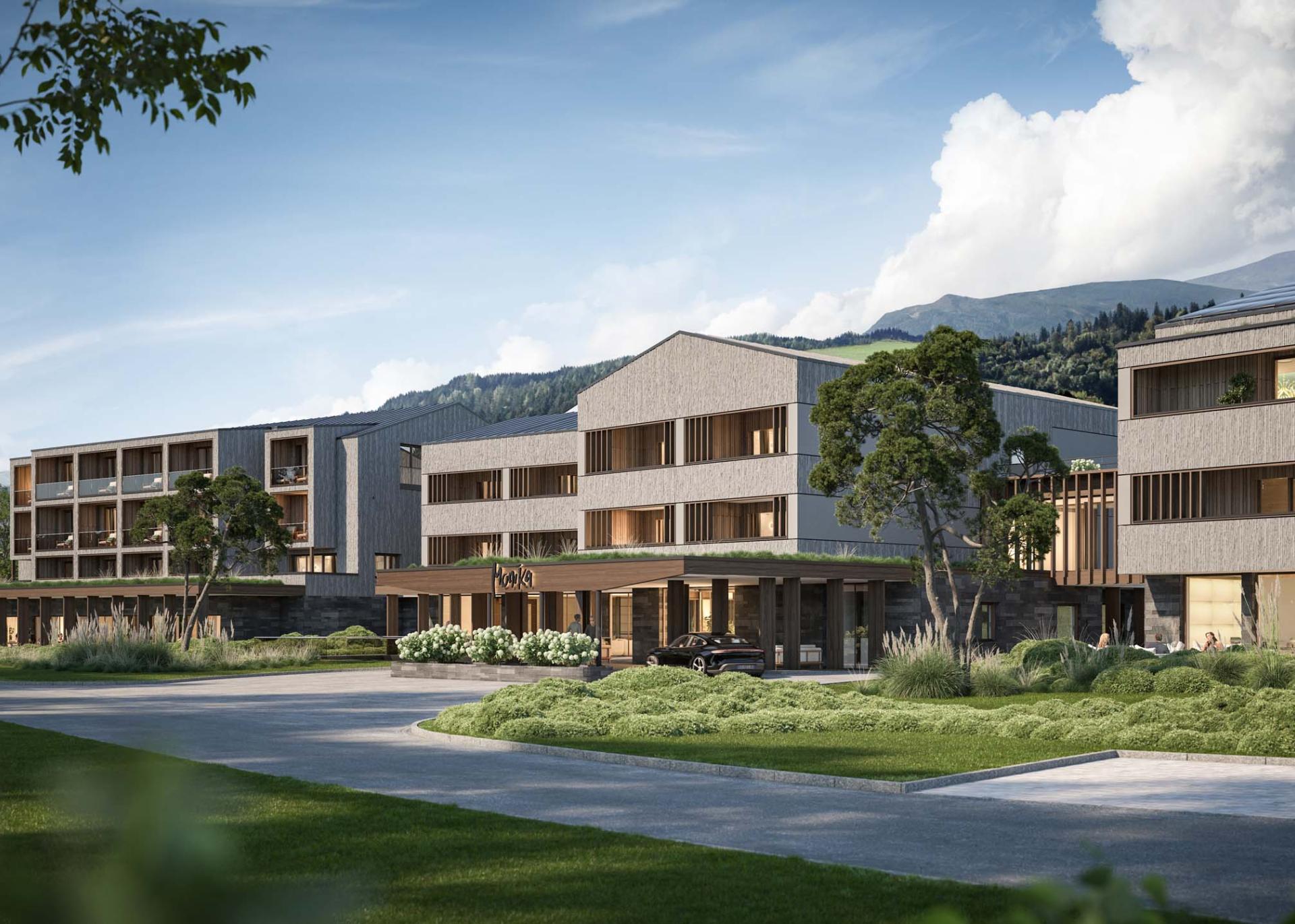 Hotel Monika in natürlicher Umgebung mit Bergen im Hintergrund