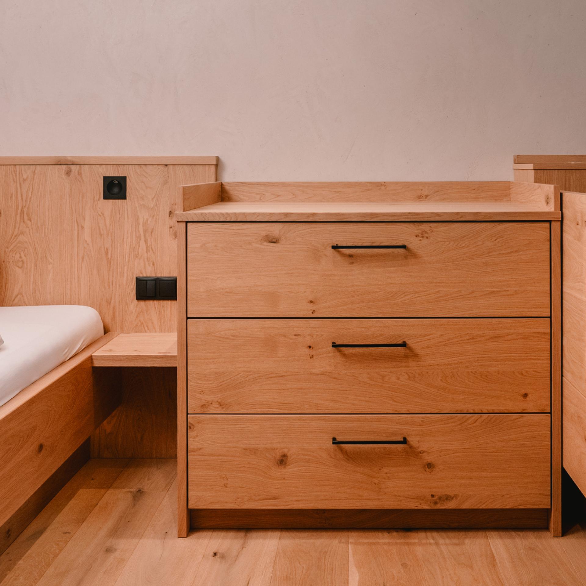 Modern family room at Familienresort Buchau with light wooden furniture