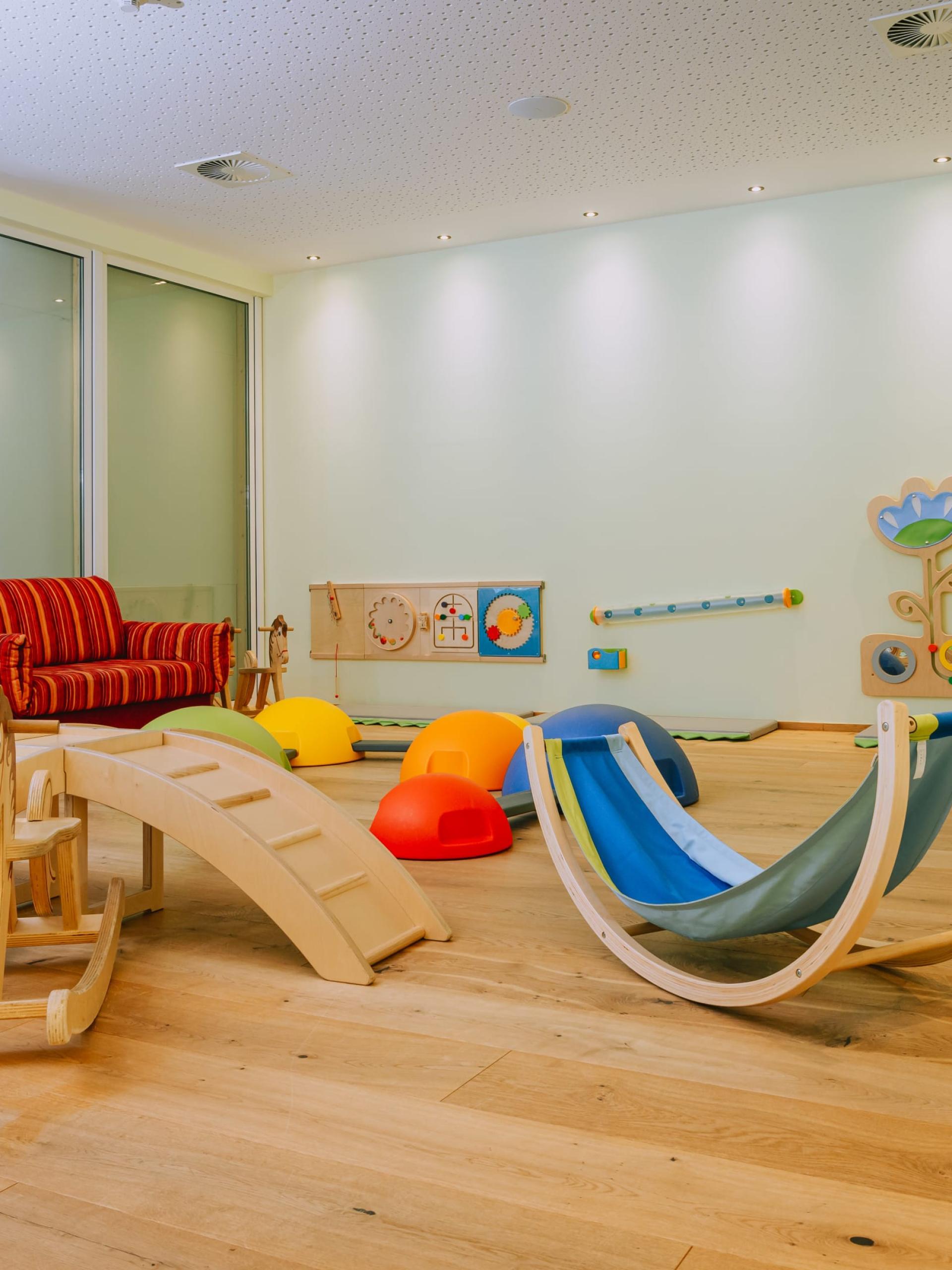 Playroom at Familienresort Buchau with colorful toys and child-friendly equipment