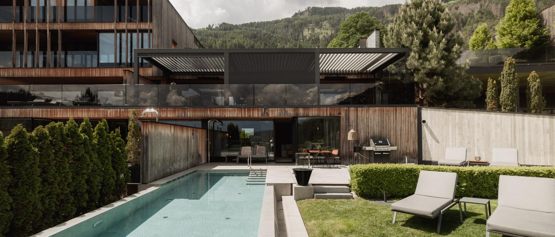 Chalet Purmontes with modern design, pool, and mountain view