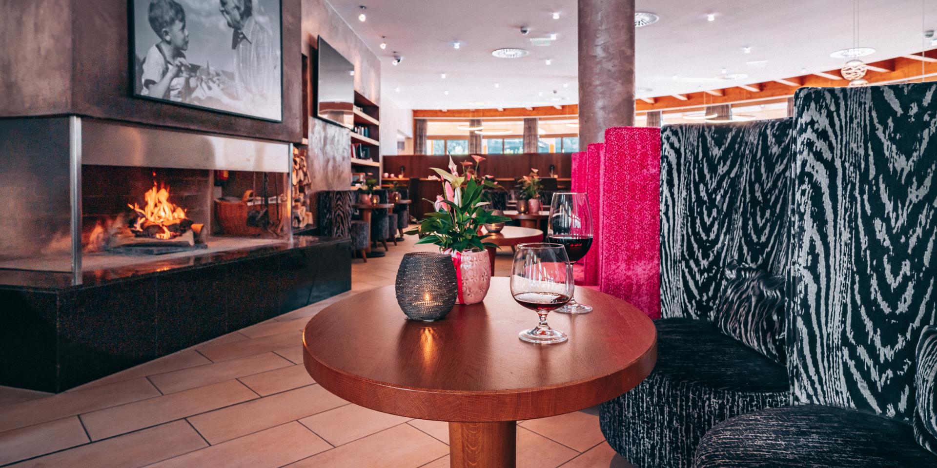 Cozy lounge with fireplace at Familienresort Buchau