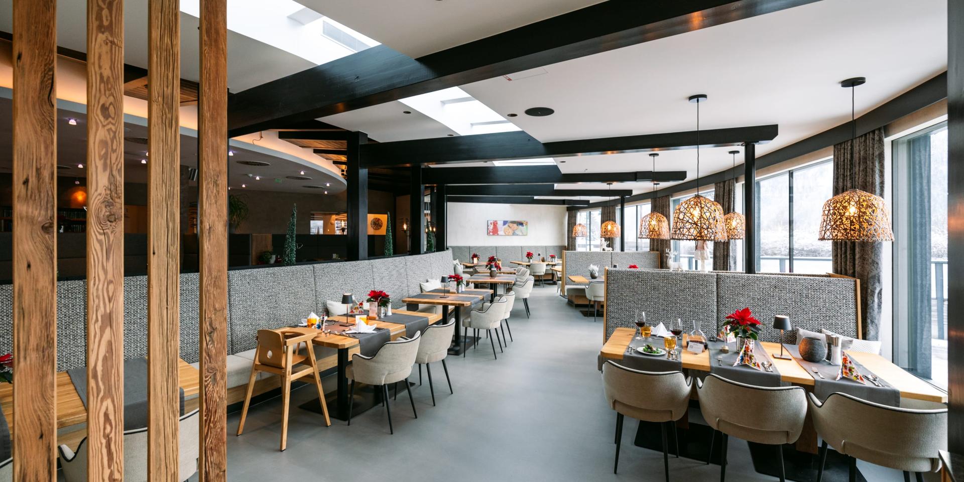 Modern restaurant in Familienresort Buchau with stylish tables and chairs
