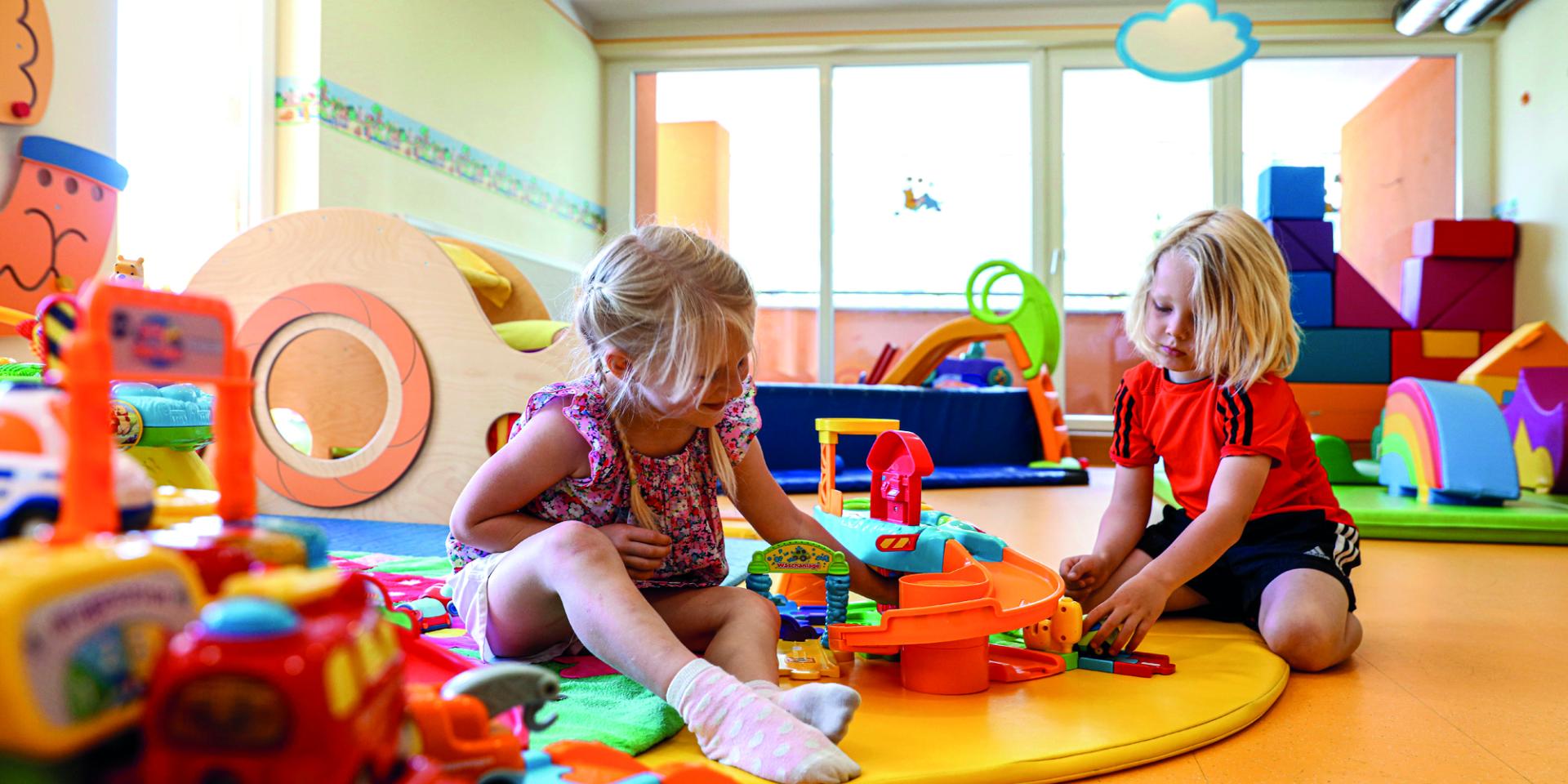 Children playing in colorful play area at Familienresort Buchau