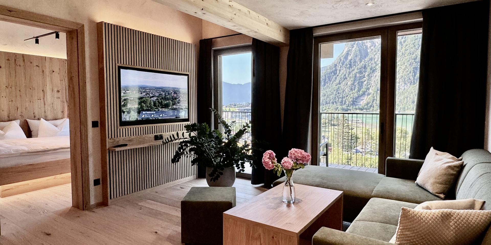 Modern living room with mountain view at Familienresort Buchau