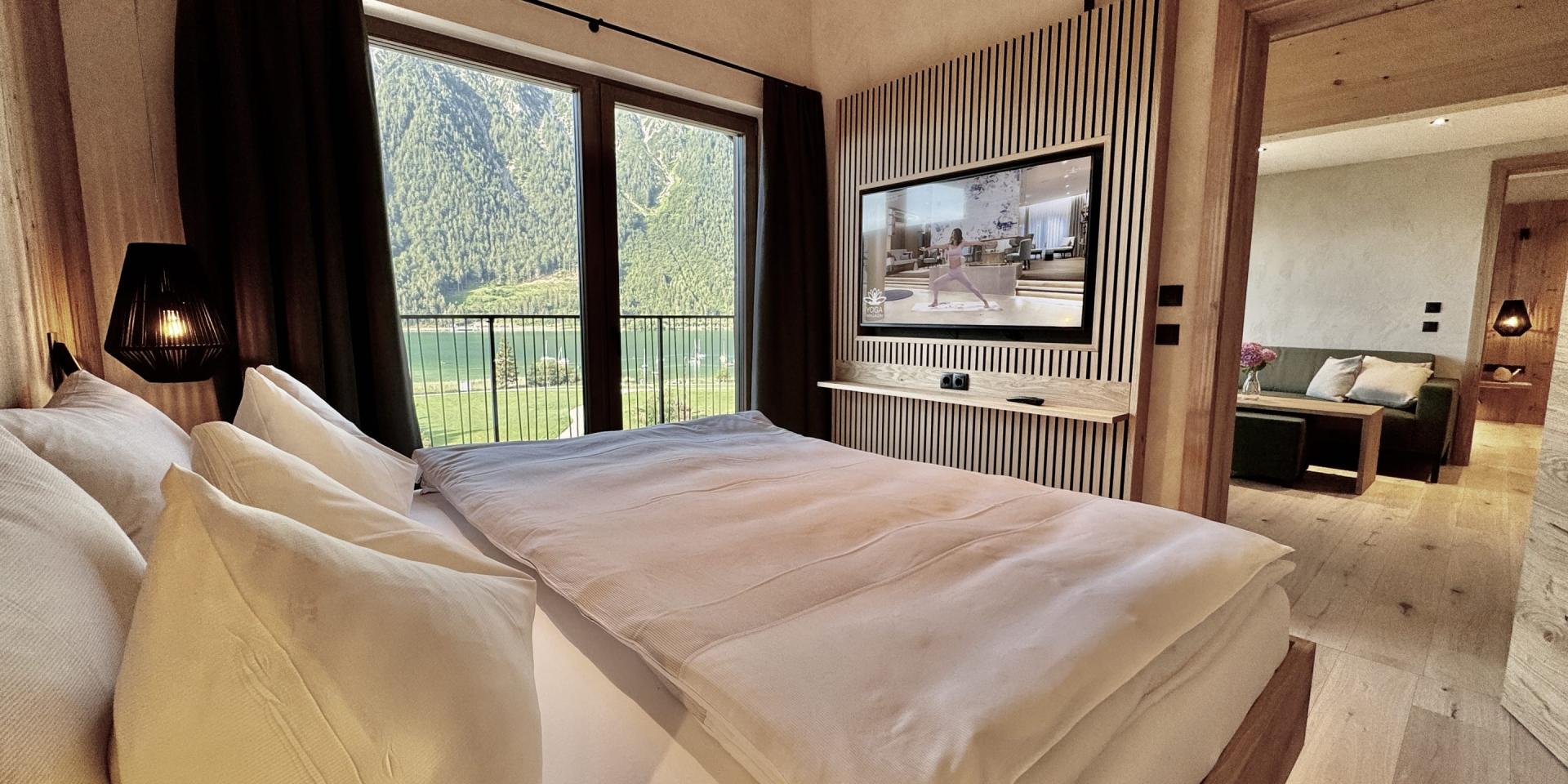 Bedroom with mountain view at Familienresort Buchau