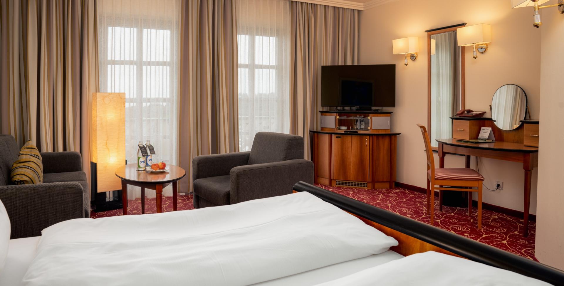 Gemütliches Zimmer im Sport- und Wellnesshotel Angerhof ****S mit Sitzbereich