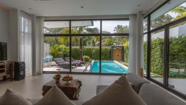 Living room view of pool and garden at The Mangosteen Ayurveda & Wellness Resort