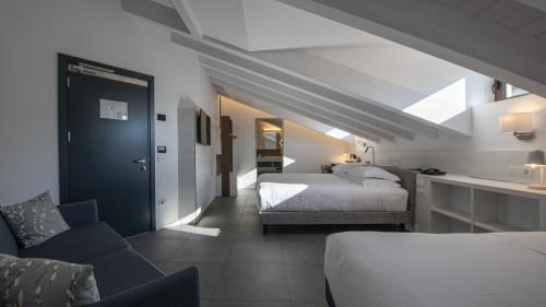 Modern hotel room with slanted ceiling at Hotel Touring Verona
