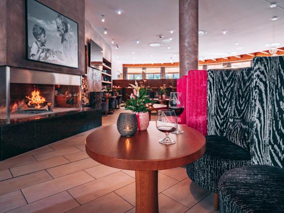 Cozy lounge with fireplace at Familienresort Buchau