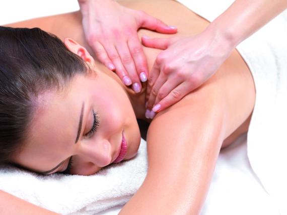 Woman enjoying relaxing massage at Familienresort Buchau