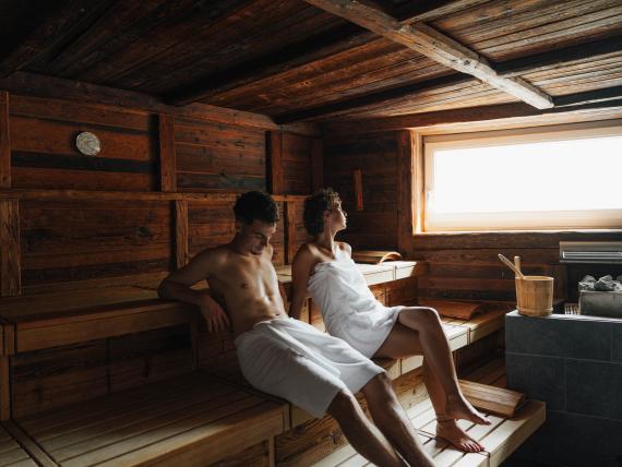 Woman relaxing in sauna at Post Seefeld Wellnesshotel Tirol