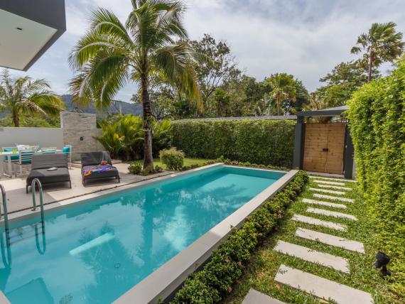 Swimming pool and garden at The Mangosteen Ayurveda & Wellness Resort