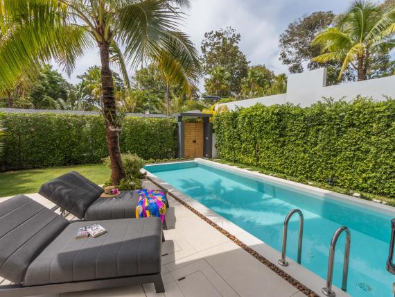 Private pool and lounge chairs at The Mangosteen Ayurveda & Wellness Resort