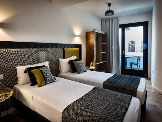 Camera con due letti singoli al Teku Boutique Hotel