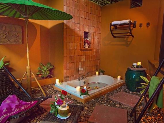 Cozy spa area with bathtub at The Mangosteen Ayurveda & Wellness Resort