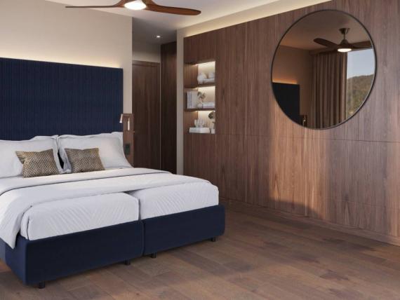 Modern bedroom with Krumers Alpin design, blue bed and round mirror