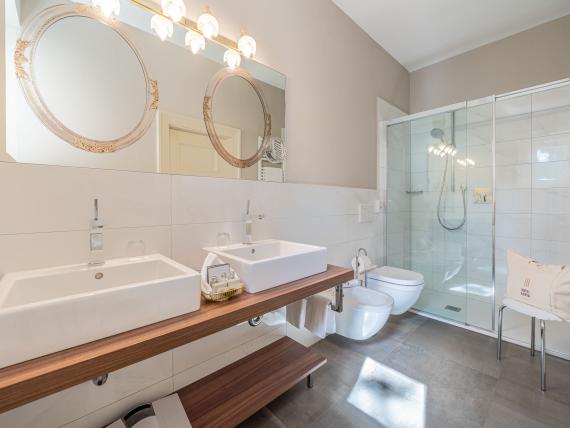 Modern bathroom with double sinks in Hotel Adria