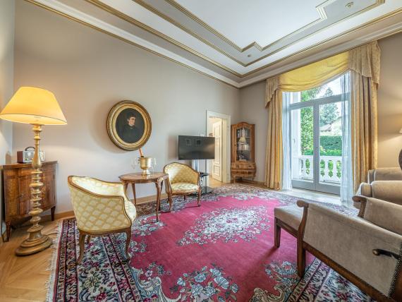 Hotel Adria elegant lounge with antique furniture and large window