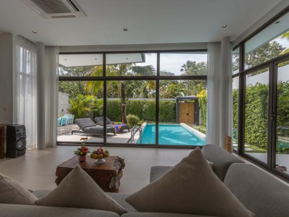 Living room view of pool and garden at The Mangosteen Ayurveda & Wellness Resort