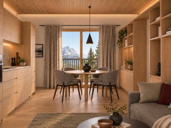 Gemütliches Bett mit rot kariertem Kissen und flauschiger Decke im Hotel Panorama