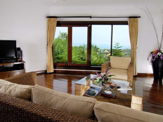 Cozy living room with garden view at The Mangosteen Ayurveda & Wellness Resort