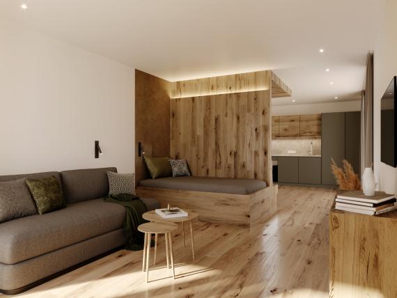 Laurena Bett mit zerknitterter weißer Bettwäsche und Kissen