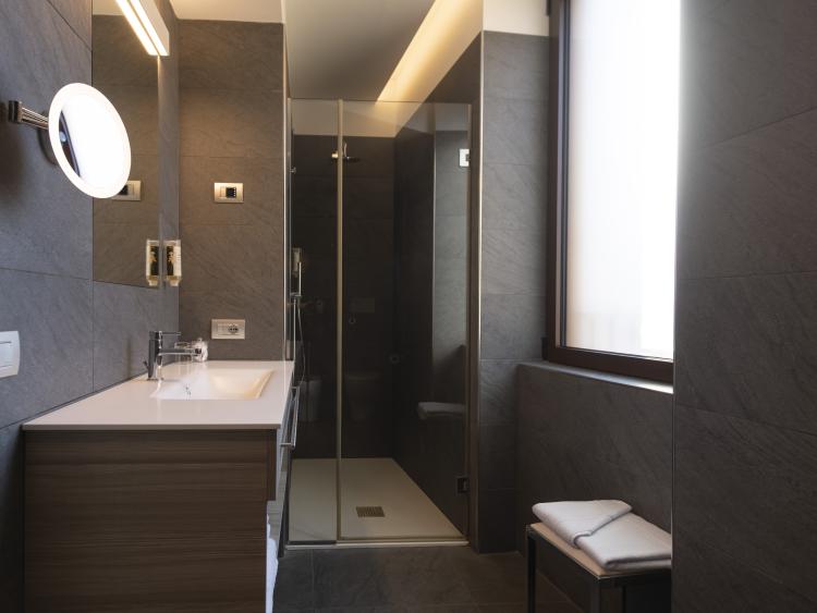 Modern bathroom at Hotel Touring Verona with sink and shower