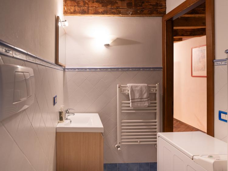 Bathroom with sink and heated towel rail at Hotel Touring Verona