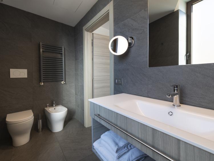 Modern bathroom at Hotel Touring Verona with toilet and sink