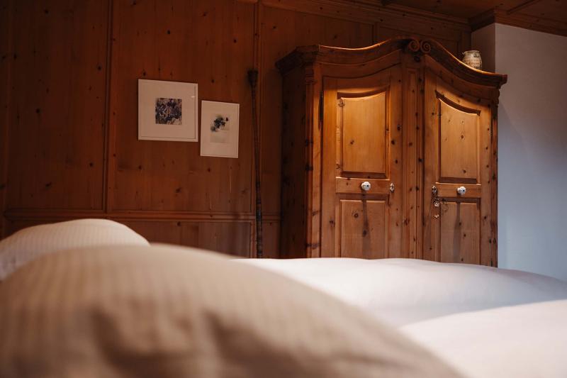 Cozy room at Hotel Aurora with wooden furniture and soft pillows