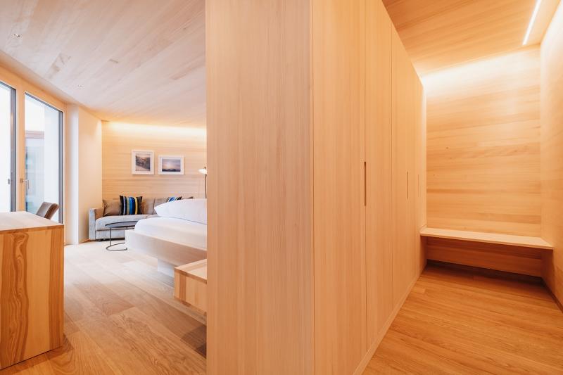 Room at Hotel Aurora with light wood paneling and modern design