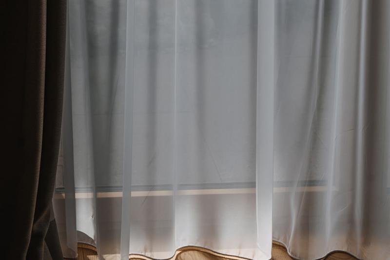 Hotel Aurora curtain with soft light on wooden floor
