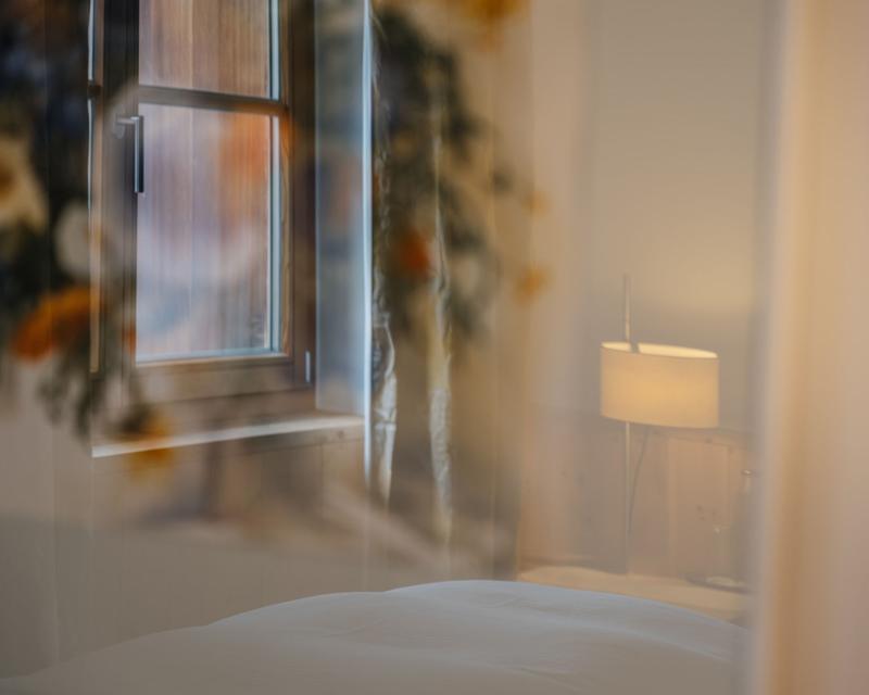 Room view at Hotel Aurora with window and lamp